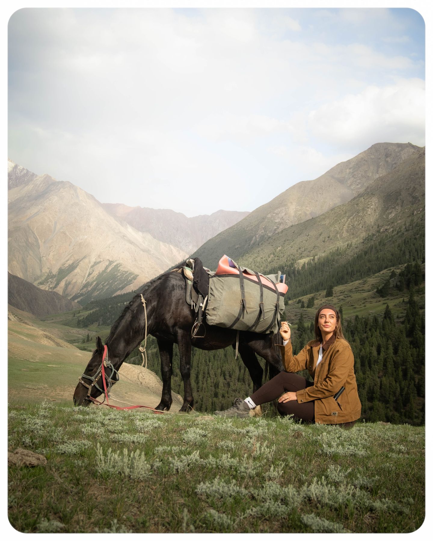 With a horse in the mountains of Kyrgyzstan