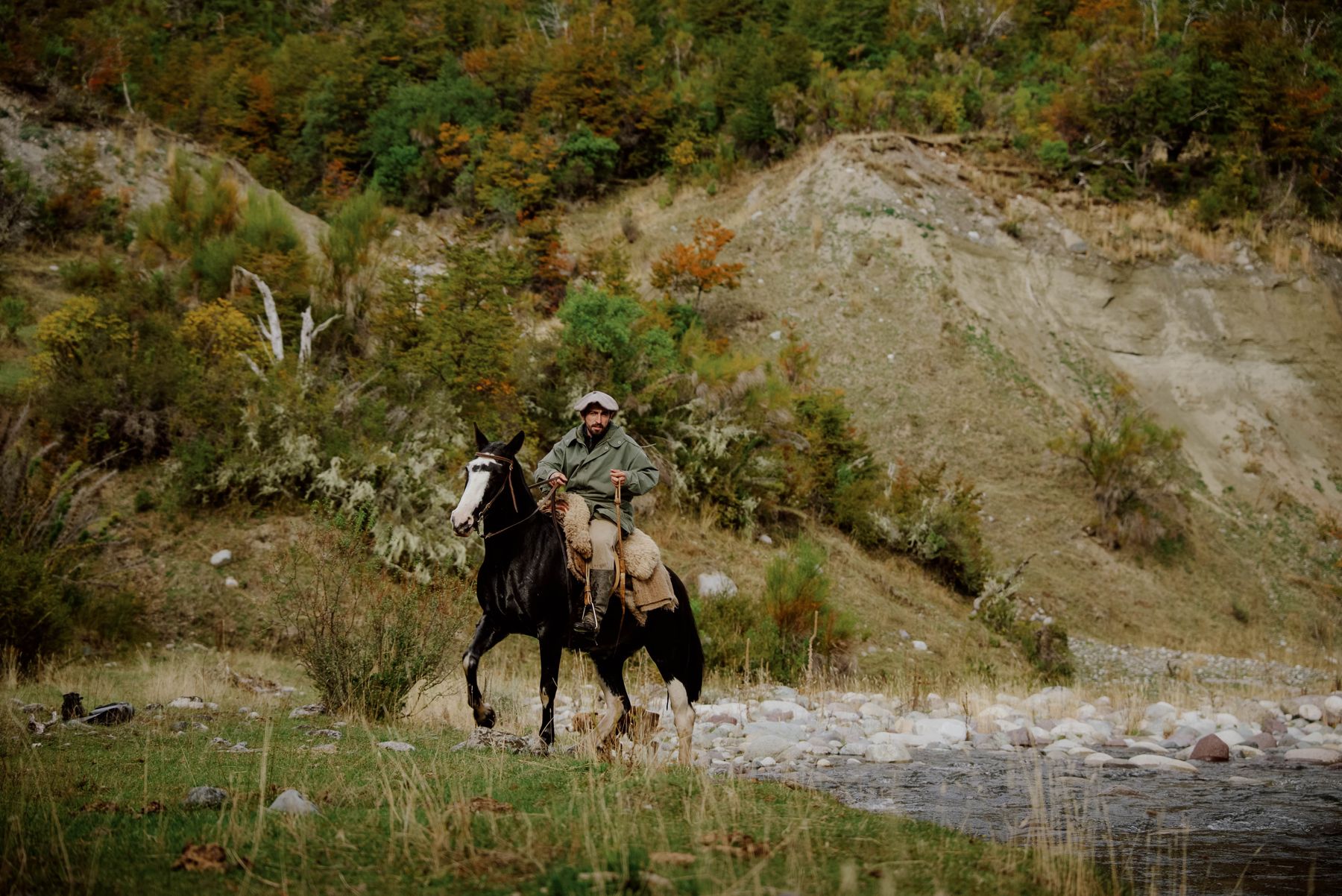 Crossing a river on horseback