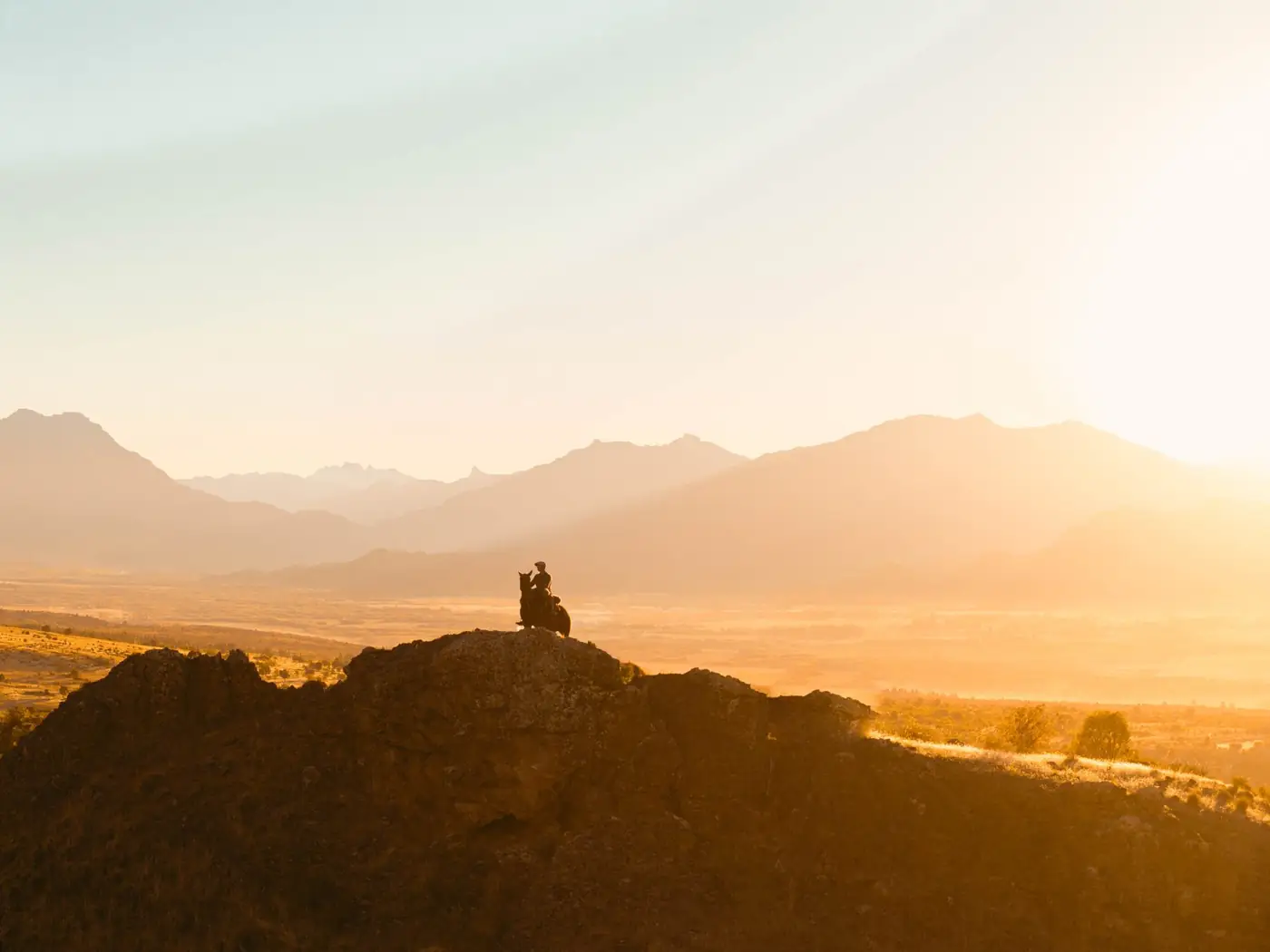 A rider silhouetted against the Patagonian sunset