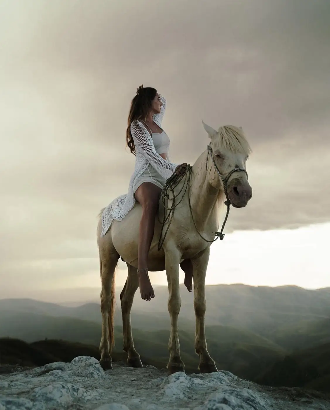 Susanne on horseback above the cliffs of Sumba